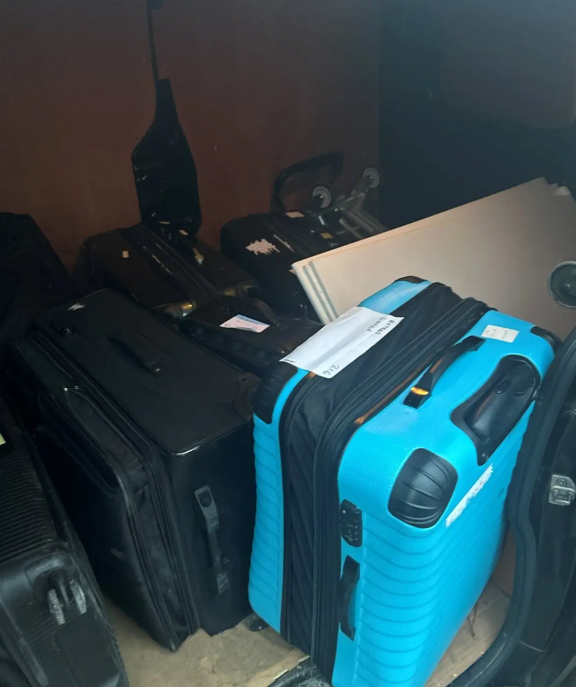 Suitcases and bags loaded in the back of a van